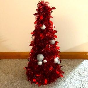Fake tiny red Christmas tree